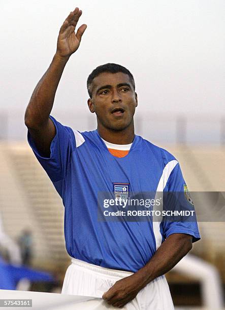 Brazilian soccer star Romario de Souza Faria, also know as "Romario", the newly acquired member of the Miami FC soccer team waves at supporters...