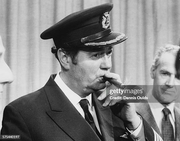 Captain Norman Todd, the pilot of British Airways Concorde, celebrates with a cigar after the aircrafts inaugural flight to Bahrain and back, at...