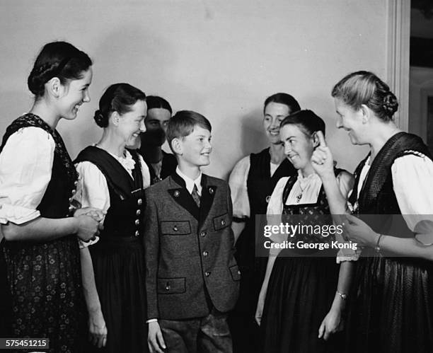 Portrait of Baroness Maria Von Trapp talking to her children, including Johannes who is the youngest family member, London, circa 1950.