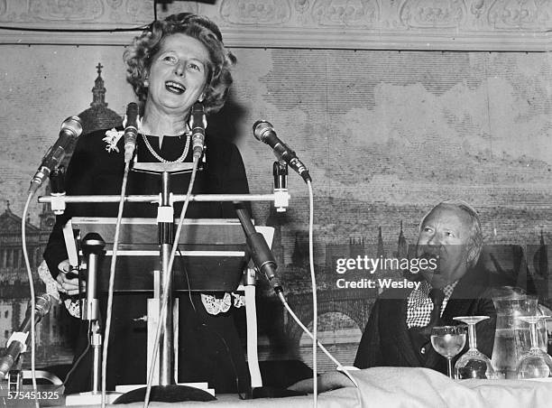 Leader of the Opposition Margaret Thatcher, watched by former leadership adversary Edward Heath, speaking as she launches the Conservative Party...