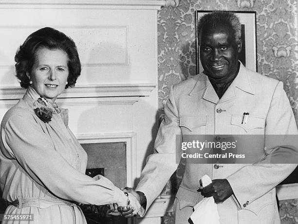 British Prime Minister Margaret Thatcher shaking hands with Kenneth Kaunda, President of Zambia, after a meeting at 10 Downing Street, London, circa...