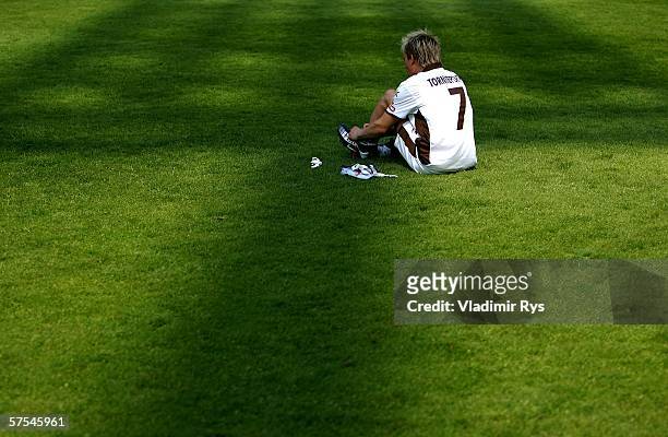 Dennis Tornieporth of Pauli sits on the grass after the final whistle of the Third League match between Rot Weiss Essen and FC St.Pauli at the...
