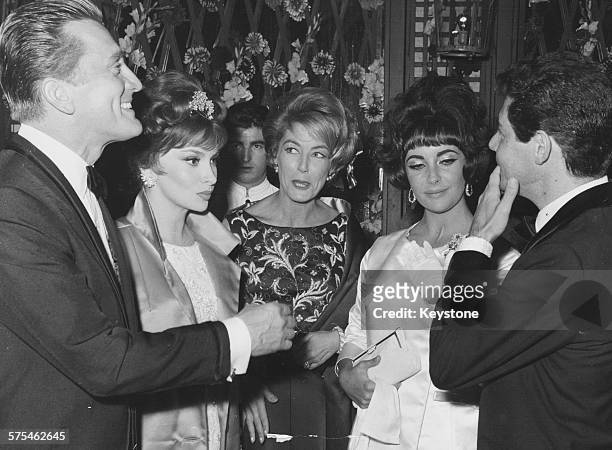 Film stars attending a party held by actress Elizabeth Taylor and singer Eddie Fisher , including Kirk Douglas, Gina Lollobrigida and Anne Douglas,...