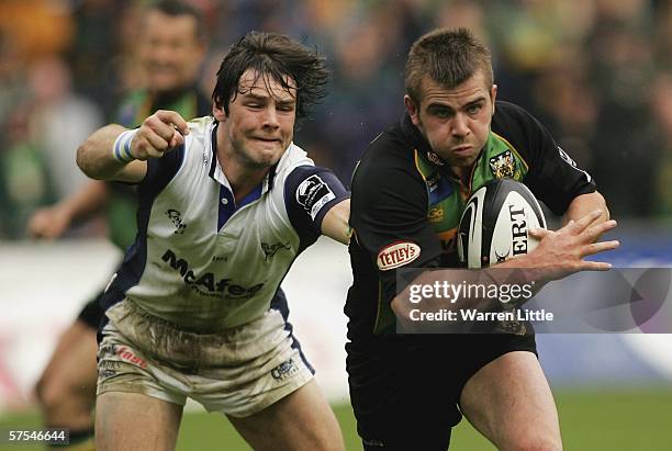 Johnny Howard of Northampton escapes a tackle from his opposite number, Ben Foden of Sale, during the Guinness Premiership match between Northampton...