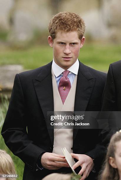 Prince Harry leaves the wedding of Laura Parker Bowles to Harry Lopes at St Cyriac's Church, Lacock on May 6, 2006 in Wiltshire, England. 26-year old...