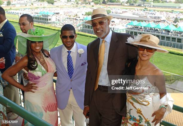 Television personality Star Jones, singer Usher, former basketball player Julius "Dr. J" Erving and wife Dorys pose in the Jockey Club at the 132nd...