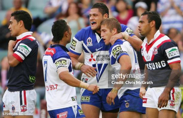 Tony Grimaldi of the Bulldogs is congratulated by team mate Willie Mason after scoring a try during the round nine NRL match between the Roosters and...