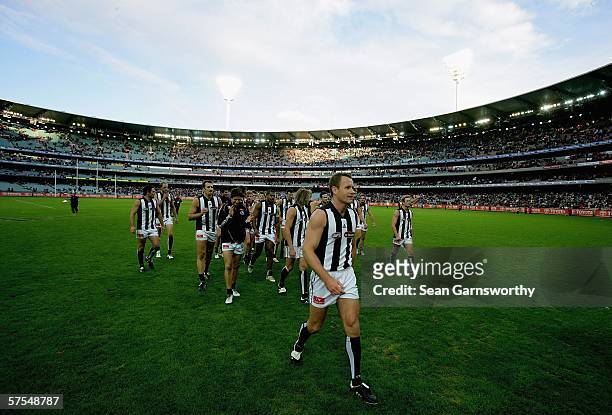 James Clement for Collingwood walks his team off after completing his 200th game after the round six AFL match between the Carlton Blues and the...