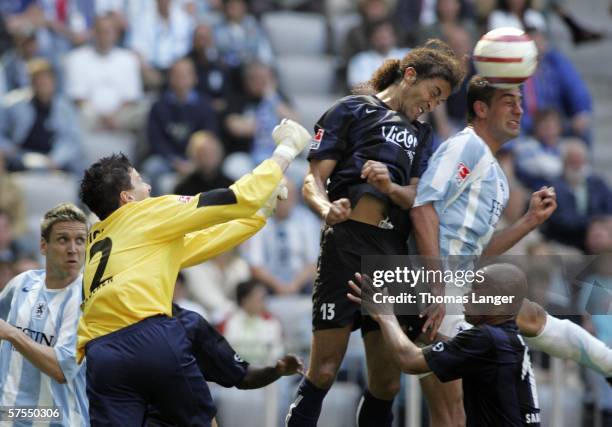 Peter Eich , Mustapha Hadji of Saabruecken and Paul Agostino of Munich battle for the ball during the Second Bundesliga match between 1860 Munich and...