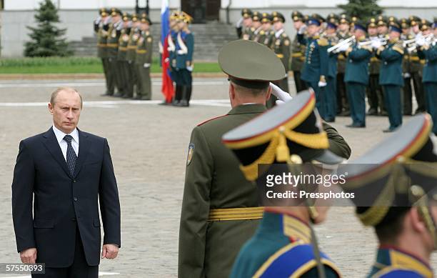 Russian President Vladimir Putin stands as he participates in the Parade of the Presidential Regiment May 7, 2006 in Moscow, Russia. The Presidential...