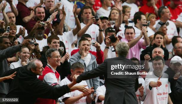 Arsene Wenger, the Arsenal manager, shakes hands with fans after the Barclays Premiership match between Arsenal and Wigan Athletic at Highbury on May...