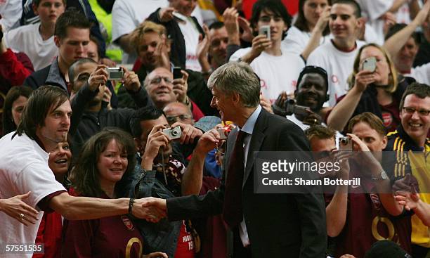 Arsene Wenger, the Arsenal manager, shakes hands with fans after the Barclays Premiership match between Arsenal and Wigan Athletic at Highbury on May...