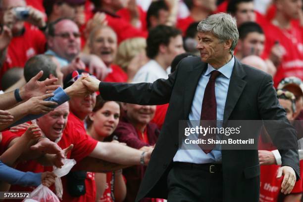 Arsene Wenger, the Arsenal manager, shakes hands with fans after the Barclays Premiership match between Arsenal and Wigan Athletic at Highbury on May...