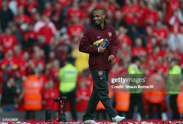 Thierry Henry of Arsenal receives his Golden Boot trophy for the leagues top goalscorer after the Barclays Premiership match between Arsenal and...