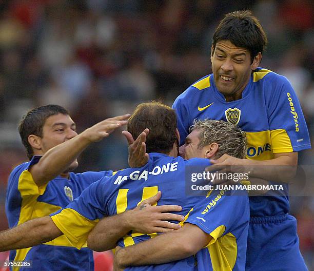 Buenos Aires, ARGENTINA: Boca Juniors' Martin Palermo celebrates with teammates Rodrigo Palacio Sebastian Battaglia and Juan Krupoviesa after scoring...