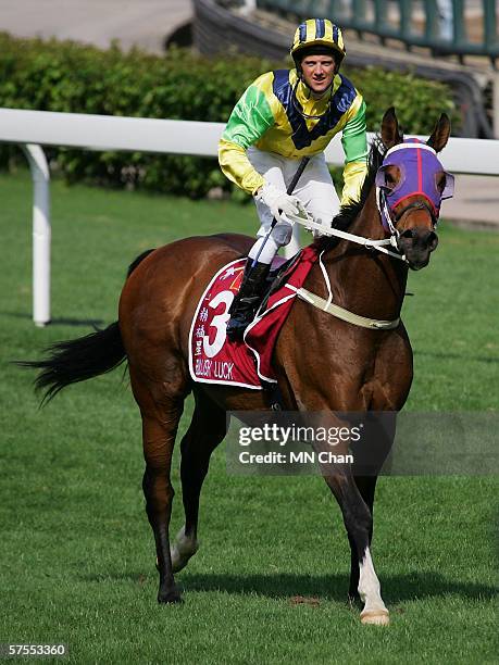 Jockey Brett Prebble celebrates atop Bullish Luck after winning the Champions Mile during the 2006 Asian Mile Challenge-Champions Mile at Shatin...