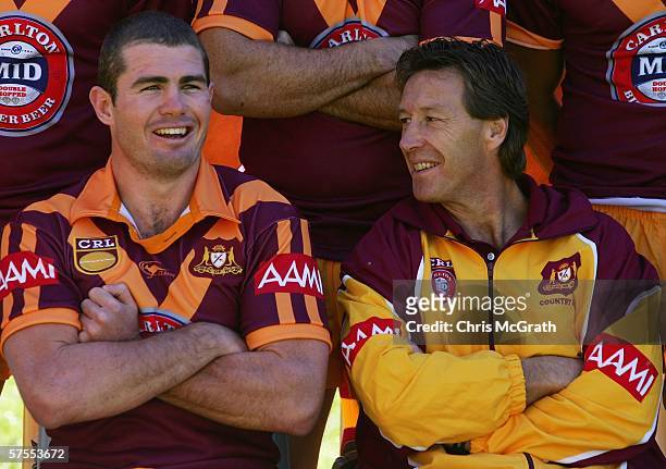 Andrew Ryan of Country talks with coach Craig Bellamy during the Country team photo session held at Aussie Stadium May 8, 2006 in Sydney, Australia.