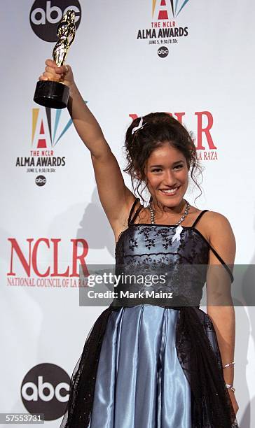 Actress Q'Orianka Kilcher poses with her ALMA Award for Outstanding Actress in a Motion Picture in the press room at the 2006 NCLR ALMA Awards at the...