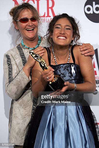 Actress Q'Orianka Kilcher poses with her ALMA Award for Outstanding Actress in a Motion Picture with her mother in the press room at the 2006 NCLR...