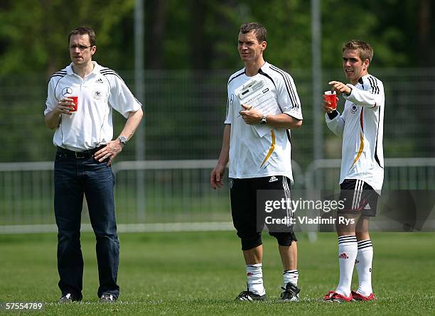 German National Team doctor Tim Meyer, fitness coach Oliver Schmidtlein and Philipp Lahm of Bayern Munich look on during fitness training of the...