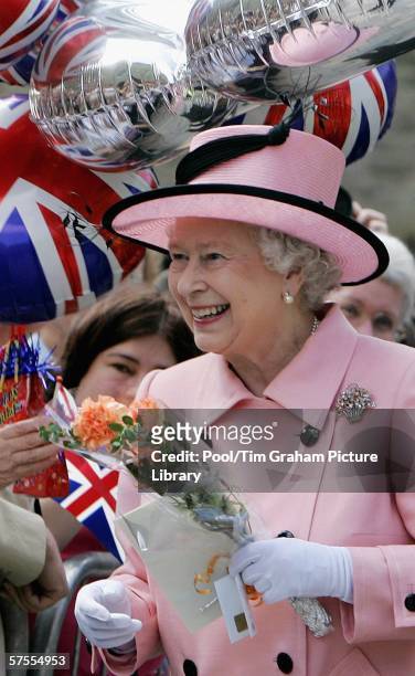 Queen Elizabeth II greets well-wishers as she tours the renovated Oxford Castle and prison which has been converted into a hotel on May 5, 2006 in...