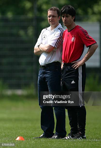 German National Team doctor Tim Meyer and assistant coach Joachim Loew look on during the fitness training of the German National Team on May 8, 2006...