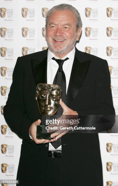 Sir Alan Sugar poses in the Awards Room with the Feature Award for The Apprentice at the Pioneer British Academy Television Awards 2006 at the...