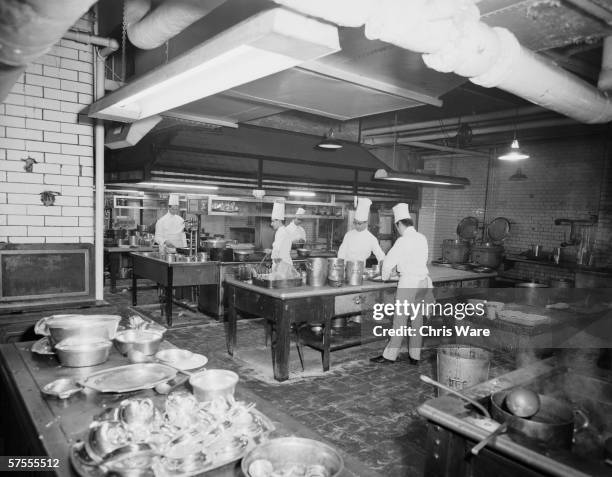Chefs at work in the kitchen of the Ritz Hotel in London, 29th May 1963.