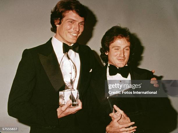 American actors Christopher Reeve and Robin Williams pose backstage at the People's Choice Awards, March 1979.