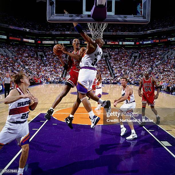 Scottie Pippen of the Phoenix Suns takes the ball to the basket against Charles Barkley of the Phoenix Suns during Game one of the 1993 NBA Finals...