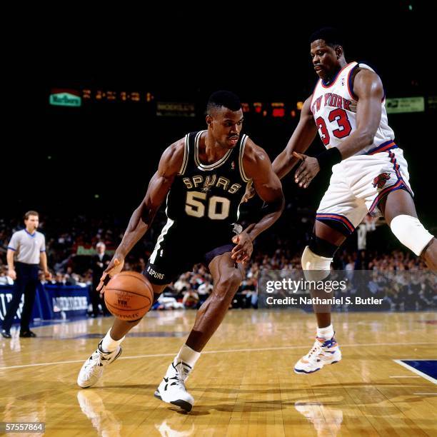 David Robinson of the San Antonio Spurs drives to the basket against Patrick Ewing of the New York Knicks at Madison Square Garden on November 21,...