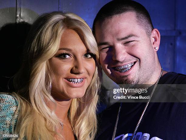 Singer Brooke Hogan and rap musician Paul Wall pose on the set of her music video shoot "Bout Us" on May 7, 2006 in Los Angeles, California.