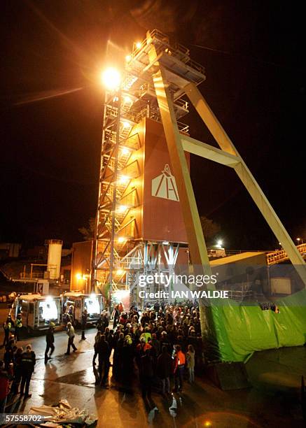 Beaconsfield, AUSTRALIA: A crowd mingles around the minehead as Tasmanian miners Brant Webb and Todd Russell are rescued from the Beaconsfield gold...