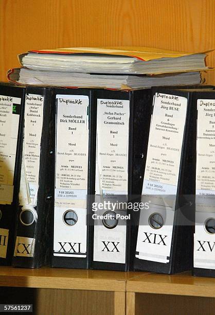 Files stand on a shelf in the courtroom during the retrial of self-confessed cannibal Armin Meiwes on 09 May 2006 at court in Frankfurt/Main,...