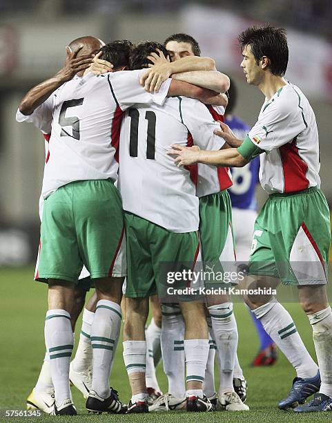 Hristo Yanev of Bulgaria is congratulated by team-mates after scoring a goal during the Kirin Cup Soccer 2006 friendly match between Japan and...