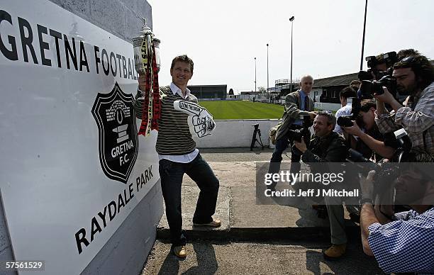 James Grady of Gretna FC is seen with the Tennents Scottish FA Cup trophy at Raydale Park May 9 Gretna, Scotland. Gretna will face Hearts at Hampden...