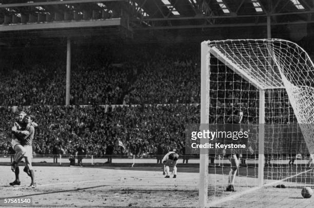 Geoff Hurst scores England's fourth goal against West Germany during the World Cup Final at Wembley Stadium, 30th July 1966. England won the match...