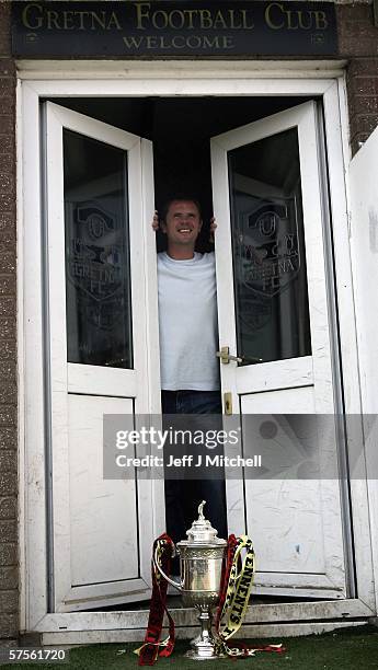 John O'Neil of Gretna FC is seen with the Scottish Cup trophy at Raydale Park on May 9 Gretna, Scotland. Gretna will face Hearts at Hampden Park in...