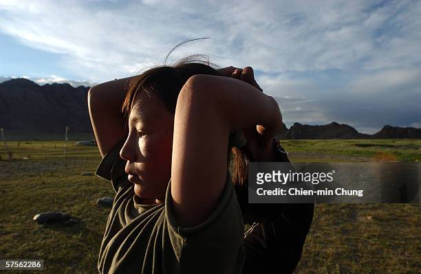 Bolor practicing her stretching on July 6, 2005 in Khovd, Mongolia.