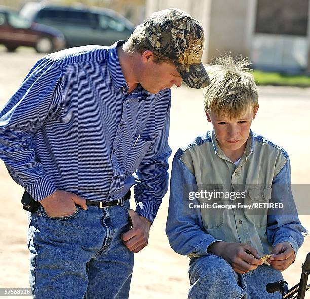 With tears in his eyes 12 year old Jared Pipkin is consoled by his brother Patrick Pipkin after Fundamentalist Church of Jesus Christ of Latter Day...