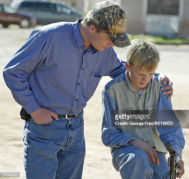 Patrick Pipkin talks with and hugs his 12 year old brother Jared after Fundamentalist Church of Jesus Christ of Latter Day Saints leaders tried to...