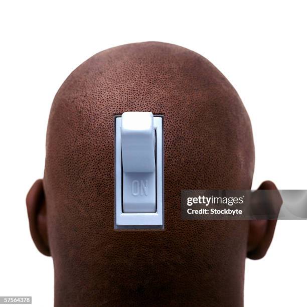 close up of an electrical switch embedded in the back of a bald man's head - shaved-buzz-cut-back-of-head photos et images de collection