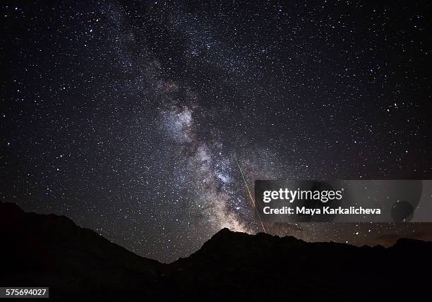perseids meteor shower with the milky way - perseid stock pictures, royalty-free photos & images