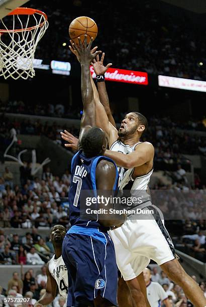 Tim Duncan of the San Antonio Spurs shoots over DeSagana Diop of the Dallas Mavericks in game two of the Western Conference Semifinals during the...