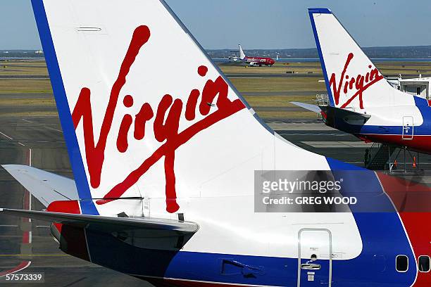 Photo taken 17 May 2004, shows Virgin Blue aircraft being prepared for flights at Sydney Airport. Logistics group Toll Holdings is expected this week...