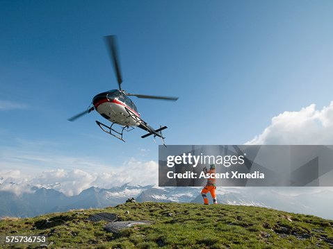 Ground crew member takes pic of departing copter Ground crew member takes pic of departing copter
