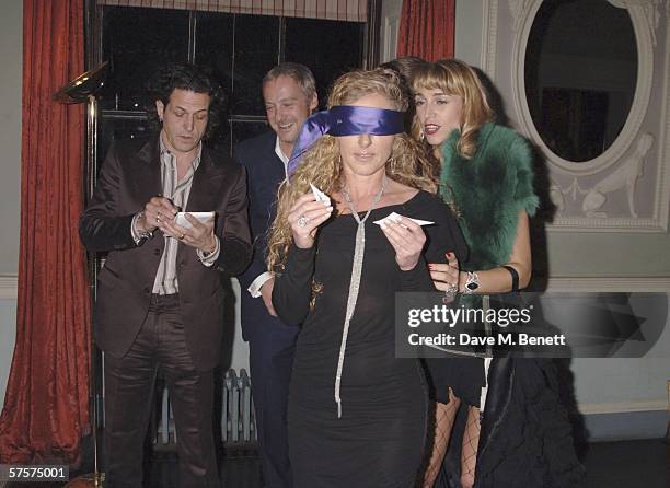 Kelly Hoppen takes part in a patry game as she attends a surprise party hosted by watch designer Stephen Webster to celebrate his 30th year in the...