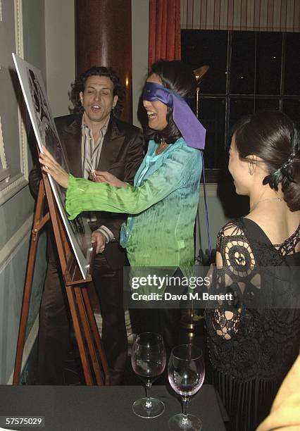 Stephen Webster and Patti Wong take part in a party game at a surprise party hosted by watch designer Stephen Webster to celebrate his 30th year in...