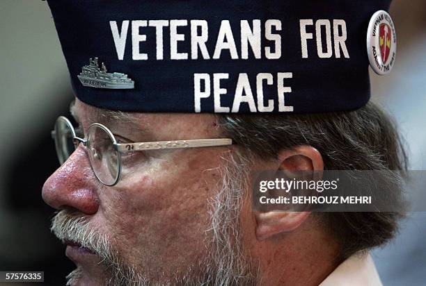 Richard Hunke, a member of the US non-governmental organisation "Fellowship of Reconciliation" wears a hat with peace slogan during a visit to a...