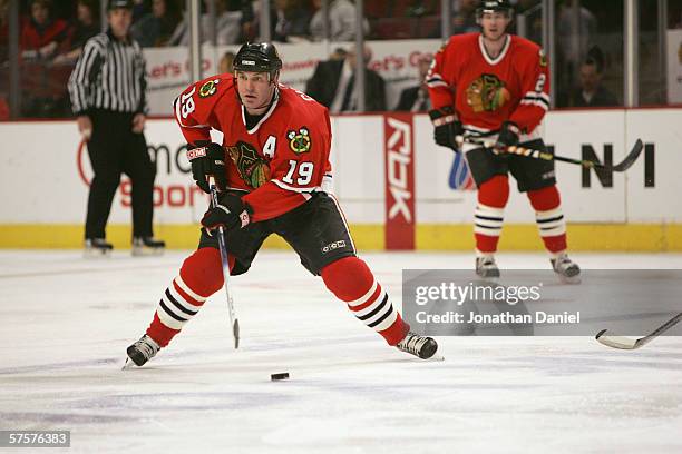 Kyle Calder of the Chicago Blackhawks handles the puck against the San Jose Sharks on March 26, 2006 at the United Center in Chicago, Illinois. The...